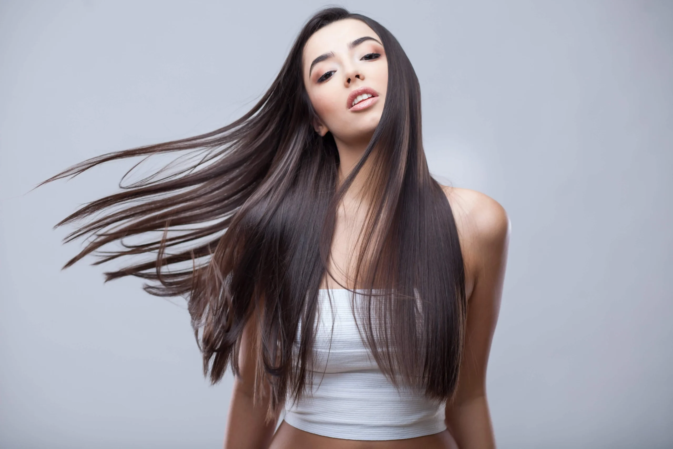 a woman with long hair | Firm & Glow | Selfishly Wellness in San Francisco, CA